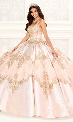 A young woman stands in a formal setting wearing the Quinceanera Dress PR30085 By Princesa, featuring pink and gold metallic embroidered lace, elegant beading, a tiara, and a necklace.