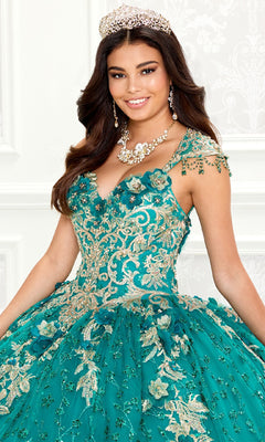 A young woman wearing a jeweled tiara, necklace, and the ornate Quinceanera Dress PR30088 By Princesa, featuring teal fabric with gold embroidery and lace details, stands in front of a white background.
