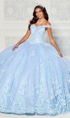 A young woman stands against a pale patterned background wearing the Quinceanera Dress PR30111 By Princesa, a light blue off-the-shoulder gown with floral lace embroidery, complemented by a tiara and jewelry.