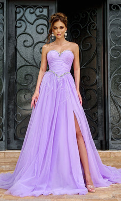 A woman stands before ornate black doors in the Long Prom Dress PS24632 by Portia and Scarlett, a lilac strapless A-line tulle ball gown featuring a beaded sweetheart neckline, floor-length skirt with slit, and matching earrings.