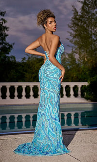 A woman in the Long Prom Dress PS24812 by Portia and Scarlett, a strapless sequin gown, poses by a pool with one hand on her hip, set against trees and a white balustrade.