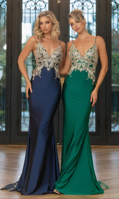 Two women stand side by side in Portia and Scarlett Long Prom Dress PS25158 gowns with ornate silver embroidery on the bodice—one in navy, one in emerald—each featuring a striking fitted floor-length silhouette.