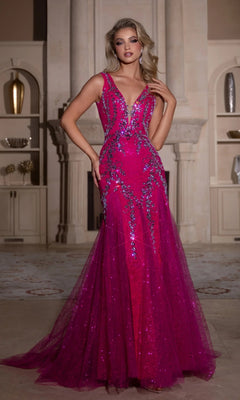 A woman poses indoors in a formal setting, wearing the Portia and Scarlett PS25289 long prom dress—a sleeveless, floor-length magenta mermaid gown with crystal embellishments.
