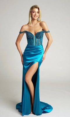 Smiling woman wearing the Portia and Scarlett PS26046 long formal dress in teal, featuring an off-the-shoulder beaded corset bodice, high leg slit, and train, standing against a plain background.