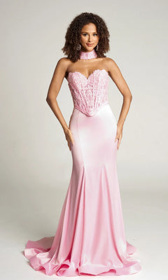 A woman wears the Portia and Scarlett PS26086 long formal dress in baby pink, featuring a strapless satin design with a lace corset bodice and matching lace choker, set against a plain background.