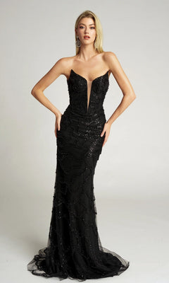 A woman models the Portia and Scarlett PS26126 long formal dress, a black strapless beaded gown with a deep V neckline and floor-length silhouette, set against a plain light background.