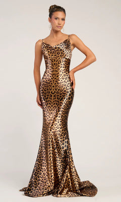 A woman poses against a plain light background in the Portia and Scarlett PS26257 long prom dress, featuring a sleeveless, floor-length leopard print design with a fitted silhouette and slight train.