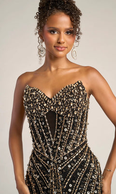A woman wears the Portia and Scarlett PS26403C long formal dress with a strapless, sweetheart neckline and gold-silver sequin embellishments, paired with hoop earrings and curly hair, set against a neutral background.