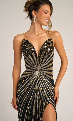 A woman in the Portia and Scarlett PS26409C long formal dress—a black and gold beaded gown with a strapless design, plunging neckline, and thigh-high slit—stands smiling, accessorized with large "P" earrings.
