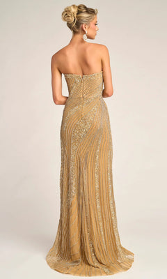 A woman faces away, wearing the Portia and Scarlett PS26410C long formal dress in gold with sparkling beaded embellishments, her hair styled in an elegant updo.