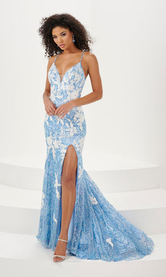 A woman in the Floral Cracked-Ice Sequin Long Prom Dress 14157—light blue with white floral patterns, high slit, and thin straps—stands gracefully on white steps wearing silver high heels.