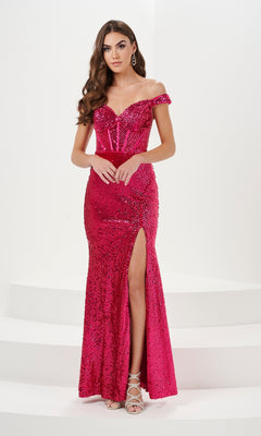 A woman wears the Off-the-Shoulder Long Sequin Prom Dress 14158, a bright pink gown with a corset-style bodice and thigh-high slit, paired with silver strappy heels, standing against a plain white background.