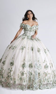 A young woman wears the Nina Canacci Q102 long Quinceanera dress with green 3D floral appliques and a tiara, standing against a plain white background, smiling slightly.