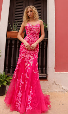 A woman stands by a shuttered window wearing the Sequin-Lace Long Neon Mermaid Prom Dress Q1390, featuring spaghetti straps, floral designs, and a fitted, flared silhouette.