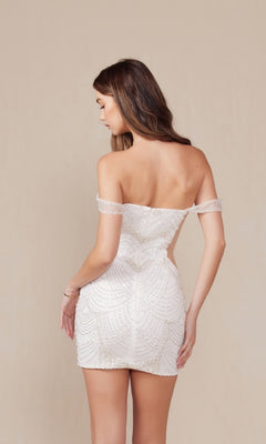 A woman faces away in the Short White Sequin Hoco Dress: Nox Anabel Q839W—an off-the-shoulder, fitted party dress—posing against a plain beige background.