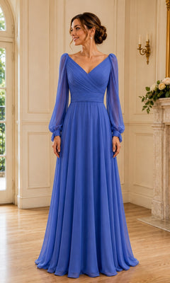 A woman wearing a cornflower blue Long Sleeve A-Line Chiffon Formal Dress: Rina Di Montella R104, featuring a floor-length A-line cut, V-neckline, and long, sheer sleeves.