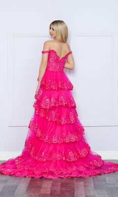 A woman faces away from the camera in the Nox Anabel Off-the-Shoulder Lace Prom Dress R1299, a bright pink tiered gown featuring delicate lace details.