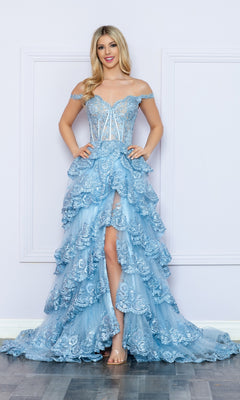 A woman poses by a light wall in the Nox Anabel Off-the-Shoulder Lace Prom Dress R1299, a light blue gown featuring a tiered ruffled skirt and sheer corset bodice for an elegant, modern look.