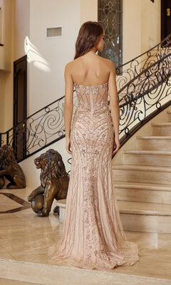 A woman in the Nox Anabel R1695 strapless long beaded prom dress stands on marble stairs with ornate railings and a lion statue in the background.