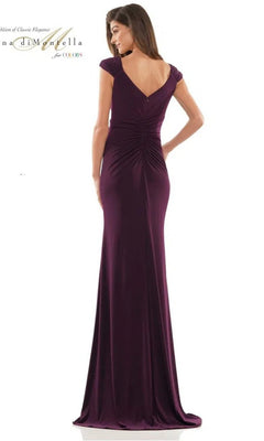 A woman models the Rina Di Montella RD2824, a floor-length deep purple jersey formal dress with cap sleeves and a gathered back, seen from behind.