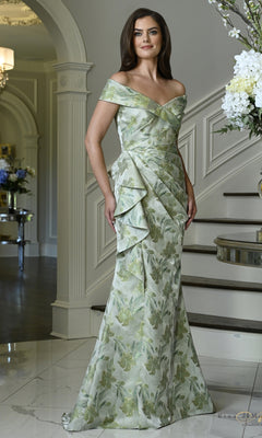 A woman wearing a Celadon Multi Floral Ruffle Mermaid Formal Dress: Rina Di Montella RD3617, an off-the-shoulder floral jacquard mermaid gown with draped side ruffles.