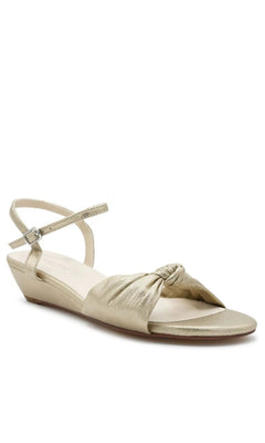 Rose Champagne Wedge Prom Shoes: Touch Ups 4729 champagne-colored wedge sandals featuring a knotted strap, adjustable ankle buckle, and open-toe design.