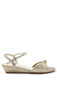 Metallic gold low-wedge champagne Rose Champagne Wedge Prom Shoes: Touch Ups 4729 with a knotted toe strap and an adjustable ankle strap.