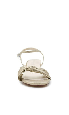 Rose Champagne Wedge Prom Shoes: Touch Ups 4729 in a gold-tone low-wedge design featuring a knotted strap and an ankle buckle.