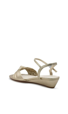 Rose Champagne Wedge Prom Shoes: Touch Ups 4729 metallic gold wedge sandals with a knotted strap and an ankle strap, featuring an open toe.