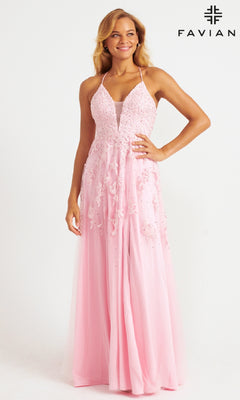 A woman smiles in a Faviana Embroidered A-Line Long Prom Dress—light pink, sleeveless, and adorned with lace and 3D floral embroidery—standing against a plain white background with the "FAVIAN" logo in the top right corner.