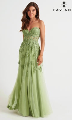 A woman models the Faviana Strapless Sweetheart Long Lace Prom Dress, a floor-length light green gown with floral lace detail, standing before a plain white background with the Fabian logo visible.