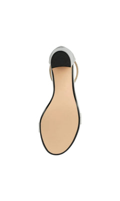 Bottom view of the Sienna Silver Prom Shoes: Touch Ups 4275, showing a silver metallic finish, a tan sole, and a black heel tip.
