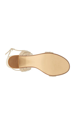 The underside of a nude patent Simone Nude Block Heel Prom Shoes: Touch Ups 4684, an ankle-strap sandal with a low block heel.