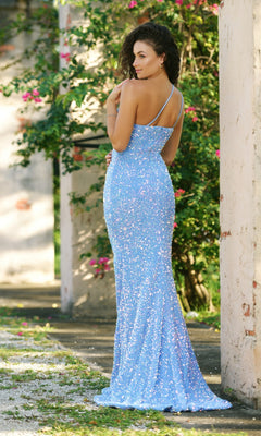 A woman stands outdoors in the Velvi One-Shoulder Long Sequin Prom Dress Stardust, a floor-length, light blue gown with sparkling sequins, posing with her back turned and head slightly over her shoulder.