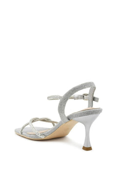 Sunny Silver Prom Shoes: Touch Ups 4733 are silver glittery heeled sandals with thin, rhinestone-embellished straps and an ankle strap with a buckle.