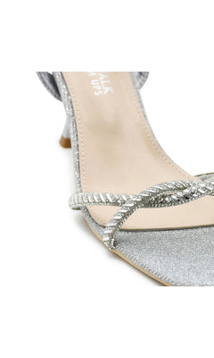 Sunny Silver Prom Shoes: Touch Ups 4733 are silver metallic kitten heel sandals featuring a rhinestone-embellished crossover strap.