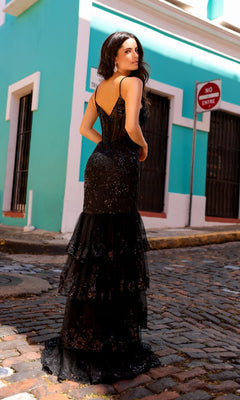 A woman stands on a cobblestone street near a turquoise building and a "No Entry" sign, her Sequin Long Ruffled Mermaid Prom Dress T1337 catching the light beautifully.