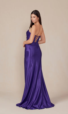 A woman poses against a plain beige background in the Strapless Lace-Up Long Prom Gown: Nox Anabel T1489—an elegant, shiny purple formal dress with a lace-up back detail.