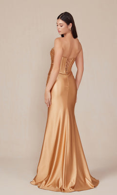 A woman models the Nox Anabel T1500, a strapless long corset prom dress with a sweetheart neckline and floor-length gold satin skirt, posed against a plain beige backdrop, turned slightly away from the camera.