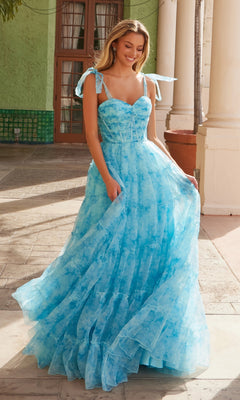 A woman stands outdoors wearing the Nox Anabel T1501, a tie-dye long ruffle prom dress with ribbon straps and a full skirt, reminiscent of a sweetheart evening gown.