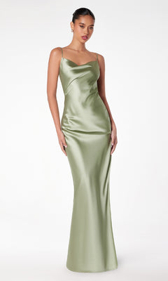 A woman models the Astee T2000 Cowl-Back Sexy Long Prom Dress, a light green satin gown with thin straps, against a plain white background.