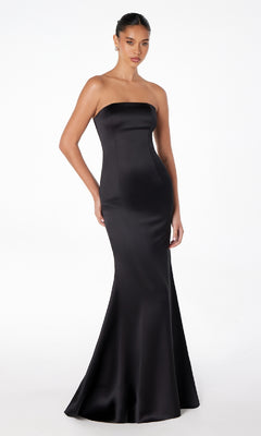 A woman wears the Choker-Sash Strapless Long Prom Dress: Astee T2012, a floor-length fitted black evening gown, standing against a plain white background.
