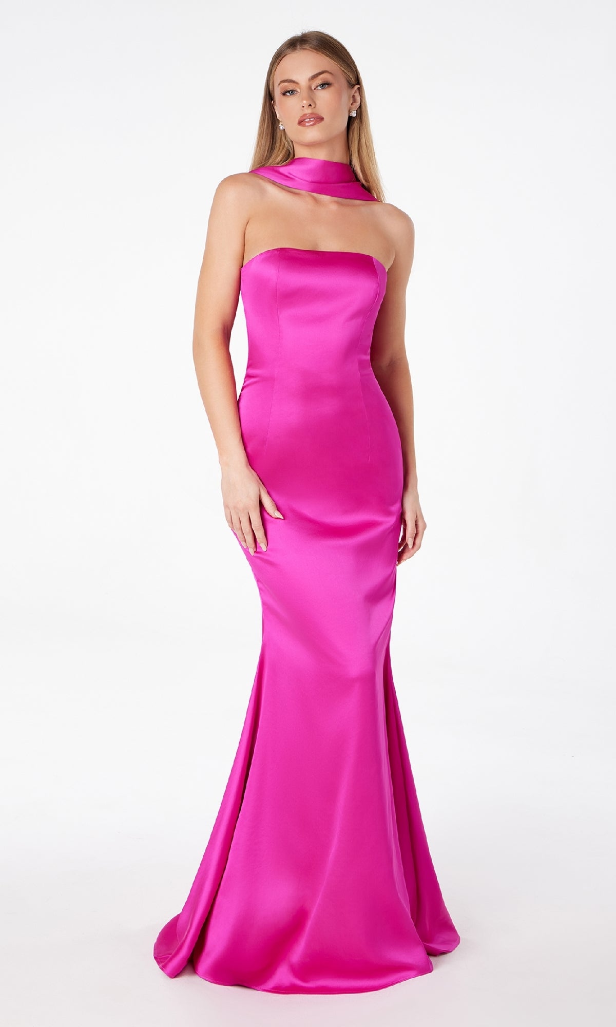 A woman models the Astee T2012 Choker-Sash Strapless Long Prom Dress in bright pink satin, floor-length and strapless, with a matching choker, standing against a plain white background.