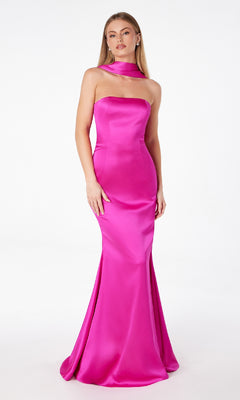 A woman models the Astee T2012 Choker-Sash Strapless Long Prom Dress in bright pink satin, floor-length and strapless, with a matching choker, standing against a plain white background.