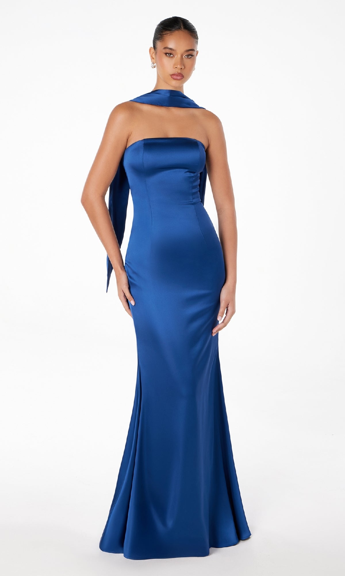 A woman models the Choker-Sash Strapless Long Prom Dress: Astee T2012, a royal blue satin, floor-length gown with a matching long scarf around her neck, standing against a plain white background.