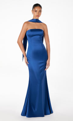 A woman models the Choker-Sash Strapless Long Prom Dress: Astee T2012, a royal blue satin, floor-length gown with a matching long scarf around her neck, standing against a plain white background.