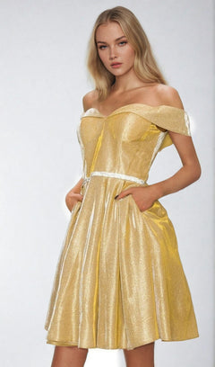 A woman models the Off-Shoulder Short Glitter Homecoming Dress 8012J, featuring short sleeves and pockets, against a plain light background.