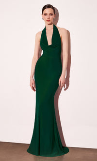 Woman wearing a green evening gown against a white background