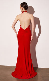 Red evening gown with open back on a white background