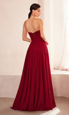 A woman with dark hair in a low ponytail models the Strapless Long Chiffon Prom Dress: Amoris T703, a floor-length red gown, standing with her back to the camera in soft lighting.